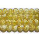 天然ゴールデンアンバー（天然琥珀）丸玉6mm（睡蓮の花、内彫）A （天然石ビーズ）