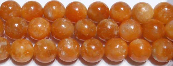 オレンジカルサイト丸玉10mmB （天然石ビーズ）